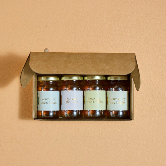 Maleny Golden Moments Honey Gift Set – Wildflower Honey Petite Jars with Heartfelt Messages

4 jars with messages: "Buzzing with Thanks", "You're the Bee's Knees", "Don't Worry, Bee Happy", &amp; "Spread the Love"