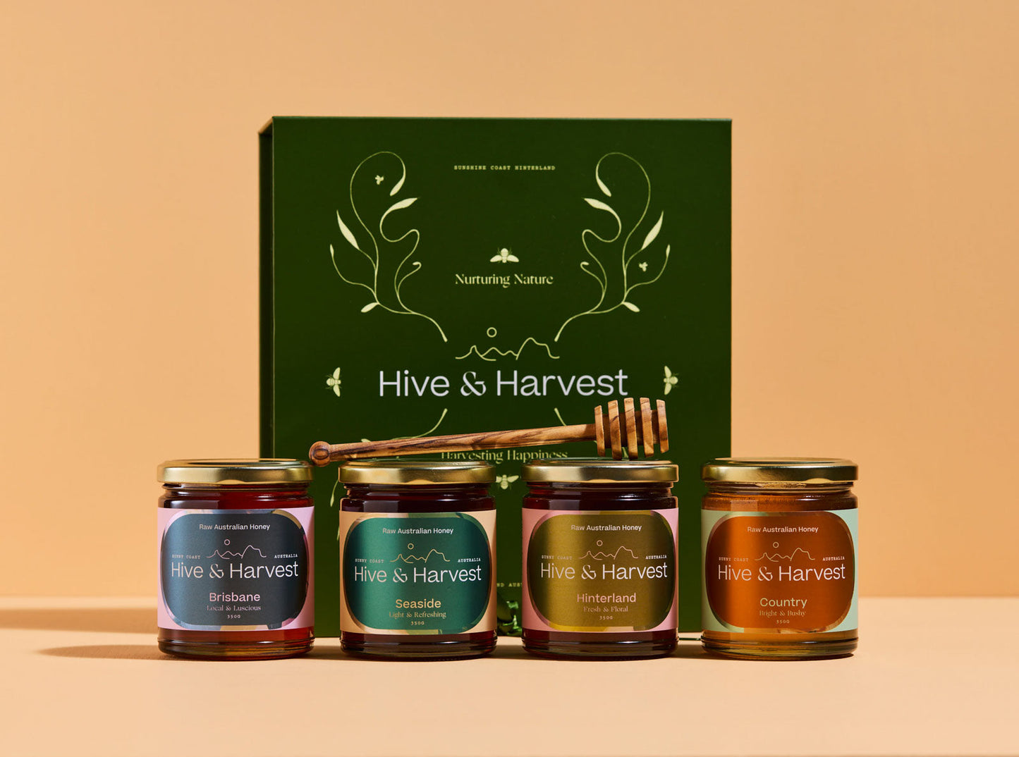 Queensland Nectar Trail Deluxe Collection with four raw honeys and olive wood dipper in gift box